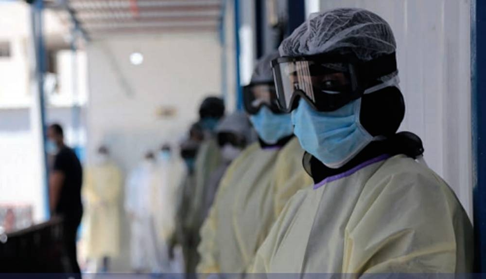 Health workers wearing personal protective equipment (PPE) at a COVID-19 isolation and treatment center constructed by IOM in Marib city. — courtesy IOM