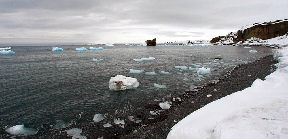 Aerial view of melting glaciers on King George Island, Antarctica. This latest report of an Arctic temperature more typical of the Tropics comes a few months after the Argentine research base, Esperanza, on the northern tip of the Antarctic peninsula, set a new record temperature. — courtesy UN Photo/Eskinder Debebe