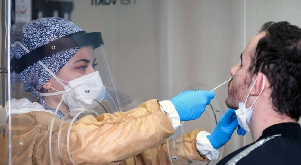 
A healthcare worker at a testing facility collects samples for the coronavirus at Mimar Sinan State Hospital, Buyukcekmece district in Istanbul, Turkey. — courtesy UNDP Turkey/Levent Kulu