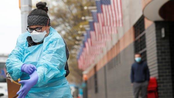 An Emergency Medical Technician (EMT) dons personal protective equipment in New York. — File photo
