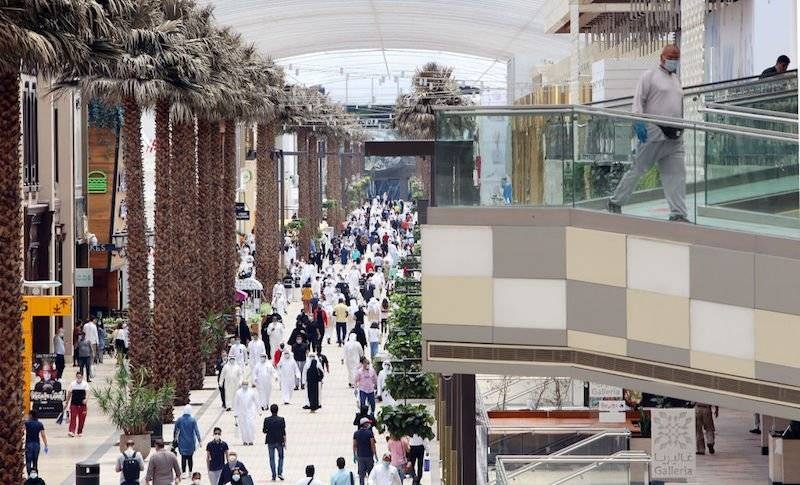 Kuwaitis wearing face masks walk inside the re-opened Avenues Mall, the country's largest shopping center, Tuesday. — Courtesy photo
