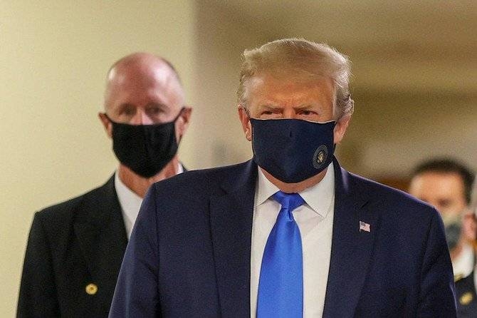 US President Donald Trump wears a mask while visiting Walter Reed National Military Medical Center in Bethesda, Maryland, Saturday. — Courtesy photo