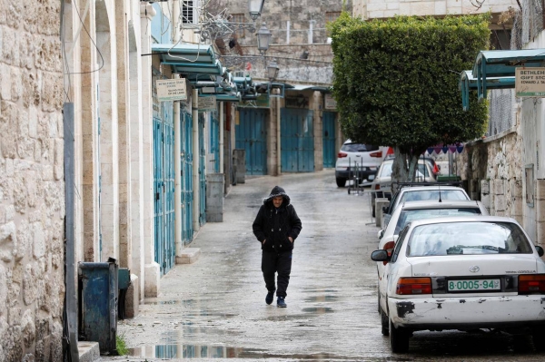 A man walks past closed shops as preventive measures are taken against the coronavirus, in Bethlehem in the Israeli-occupied West Bank. — Courtesy photo