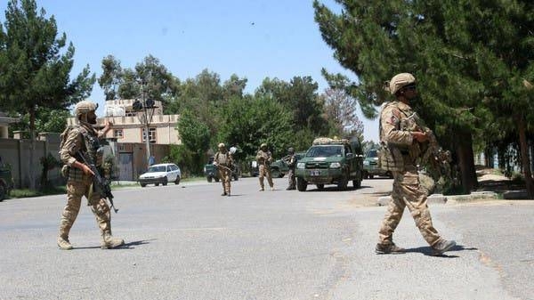 Afghan security forces take position during a fighting outside a government compound in the city of Lashkar Gah. — File photo: AP
