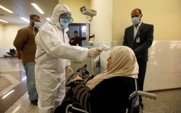 A health ministry worker conducts a random test for the novel coronavirus in Kuwait City. — Courtesy photo
