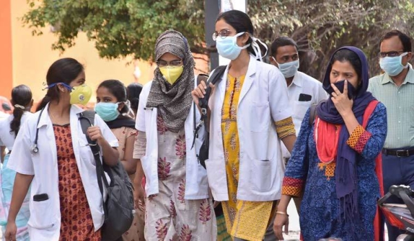 Medics walk out of Gandhi Hospital in the southern Indian city of Hyderabad. — File photo
