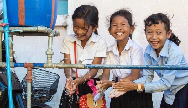 
Girls at a school in Cambodia wash their hands using water from a school WASH facility. — courtesy UNICEF/Bona Khoy