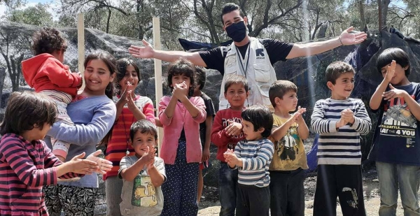 Shadi Mohammedali, a refugee from Gaza, now works for the International Rescue Committee (IRC). Here he is pictured in the Moria Refugee Camp in Greece. — courtesy IRC