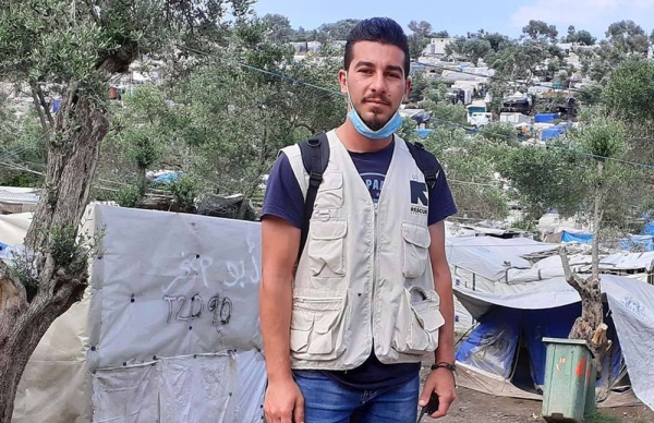 Shadi Mohammedali, a refugee from Gaza, now works for the International Rescue Committee (IRC). Here he is pictured in the Moria Refugee Camp in Greece. — courtesy IRC