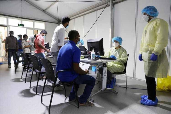 Members of medical staff carry out COVID-19 tests at the Cleveland Clinic hospital in Abu Dhabi in this file photo.
