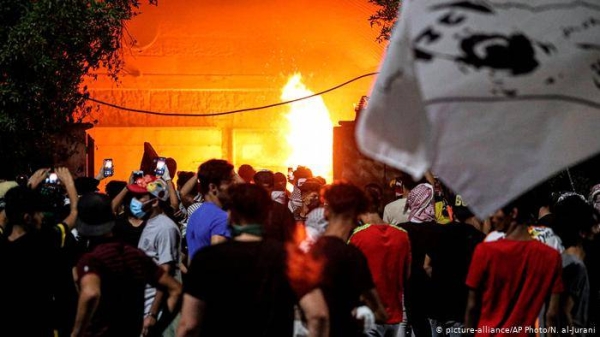 Iraqi protesters torched the local parliament office and clashed with security forces in the southern city of Basra late Friday. — Courtesy photo
