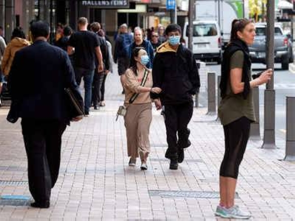 Pedestrians in an Auckland area. Stay-at-home orders would remain in place across Auckland until at least late Sunday. — File photo
