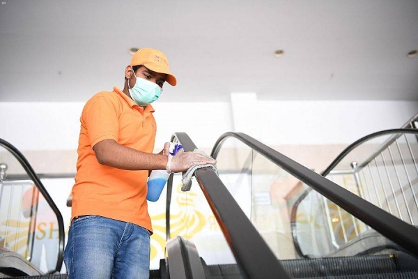 Businesses are required to adhere to precautionary measures which include providing their staff with disinfectants and sanitizers, plus take the temperatures of both staff and customers at the entrances of shopping malls. — File photo