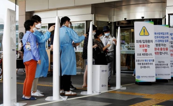 South Korea extended Friday the tighter social distancing restrictions in Seoul and its suburbs for one more week, until Sept. 13 with no definite slowdown in the infection rate.