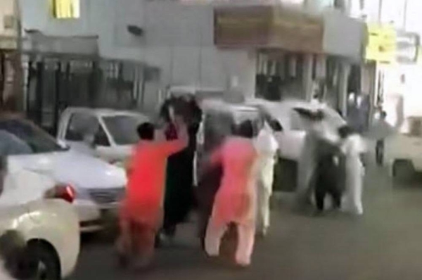 A video grab showing several people involved in a brawl in a residential neighborhood in Jeddah.