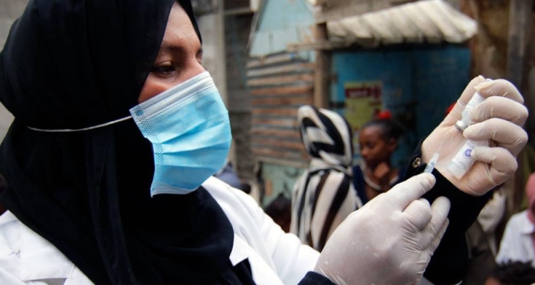 A health care worker prepares a diphtheria vaccine at Khawr Meksar clinic in Aden, Yemen, despite the COVID-19 pandemic. — courtesy UNICEF/Mahmoud Fahdl