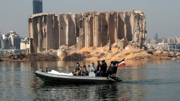 Lebanese and French troops ride a boat past the damaged grain silo near the site of the massive blast in Beirut's port area. — File photo
