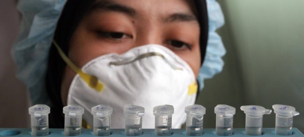 An Indonesian health worker analyzes blood samples for influenza in this file picture. — Courtesy photo