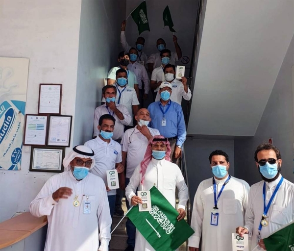 SADAFCO employees celebrate the 90th year of Saudi National Day. 