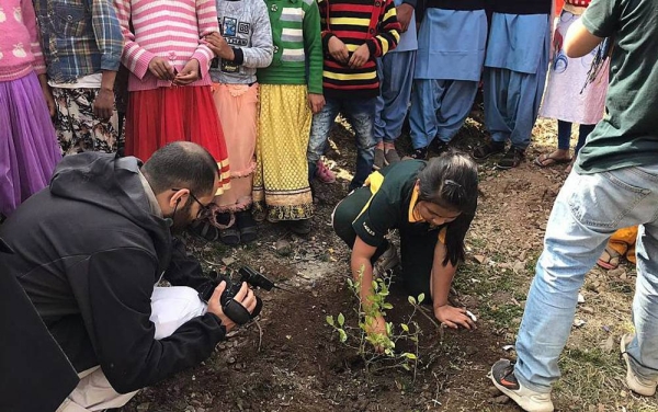 Licipriya planting a tree with a group of children. — courtesy Licypriya Kangujam