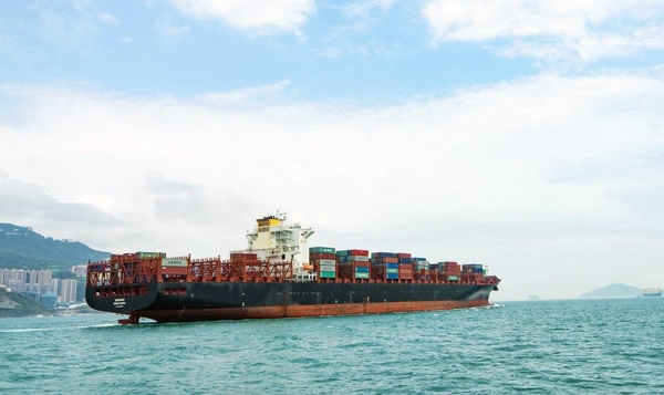 A container ship sails near Hong Kong Island. — courtesy Unsplash/Kinsey