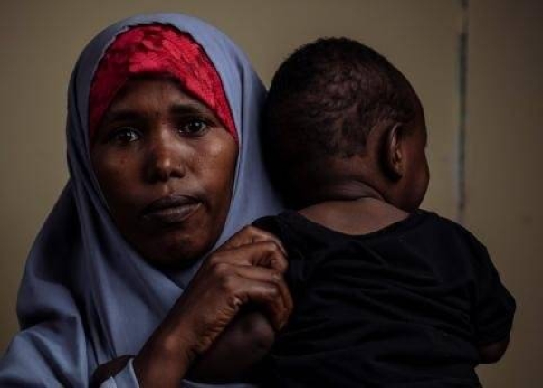 Farhiya and her eight-month-old son await return assistance to Ethiopia at a reception center in Bossaso, Somalia. — Courtesy IOM