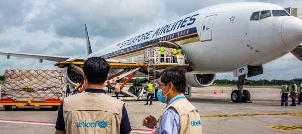 UNICEF Myanmar staff check cargo of PPE supplied by UNICEF at Yangon International airport, Myanmar. – courtesy UNICEF/Nyan Zay Htet