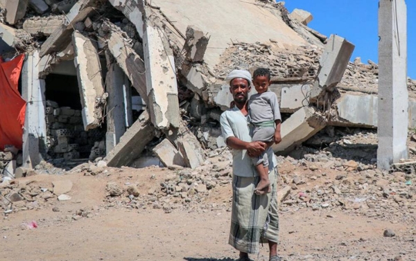 
A man holds his child at the Al-Dhale’e Internally Displaced Persons (IDPs) Camp in Yemen. — courtesy YPN for UNOCHA