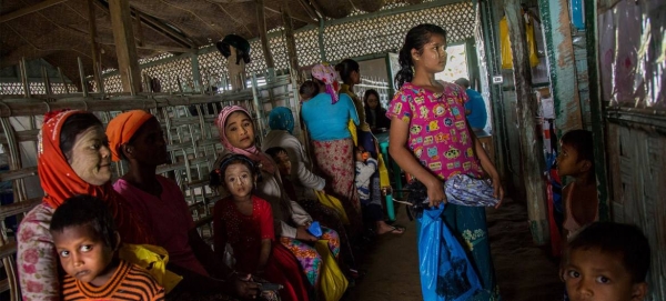 Women and children from a local community are seen at a health center in Sittwe, in Myanmar's northern Rakhine state, in this file picture. — Courtesy photo