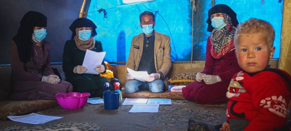 A community COVID-19 awareness session takes place at the Abnaa Mhin IDP camp in northern Idlib Governorate, Syria. — Courtesy photo