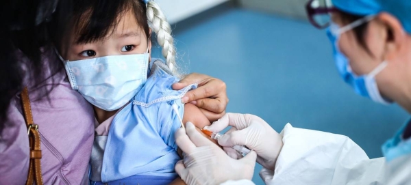 A 3-year-old girl receives a vaccine shot at a community health center in Beijing, China, in this file picture. — Courtesy photo
