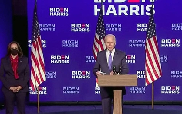 Former Vice President and Democrat candidate in the US Presidential election Joe Biden, with his running mate Kamala Harris (left) watching, makes a speech calling for unity in Wilmington, Delaware, on Friday.