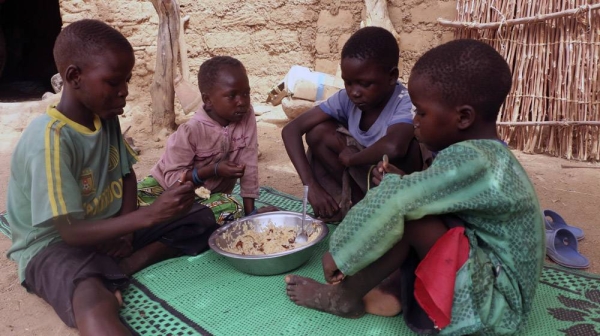 With schools closed as a preventive measure taken by the govern to curb the spread of COVID-19 in Cameroon, Koza, WFP is providing Take-Home Rations (THR) to ensure that pupils continue to study at home on a full stomach. Doudou Ltanoua’s (non visible in the Photo) school aged-children enjoy a hot meal cooked with food items provided by WFP. — courtesy  WFP/Glory Ndaka