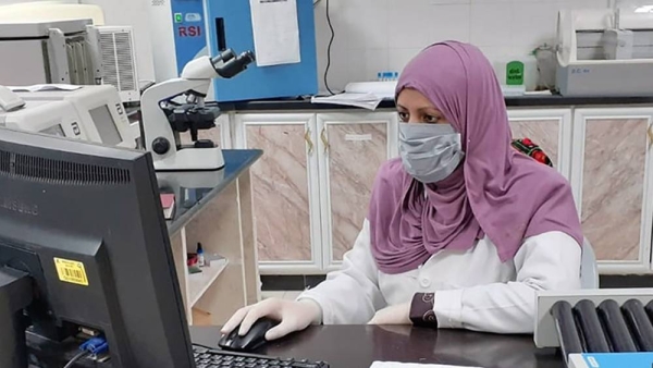 A scientist tests a sample suspected of containing a bacterial toxin. — courtesy CDC
