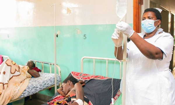 A nurse who recovered from COVID-19 is back at work helping patients at a hospital in Malawi. — courtesy UNICEF