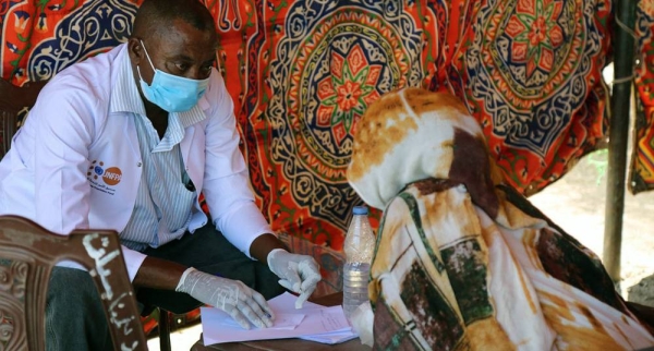 A woman receives health services at a transit point in Hamdayet, Sudan. — courtesy UNFPA Sudan/Sufian Abdul-Mout