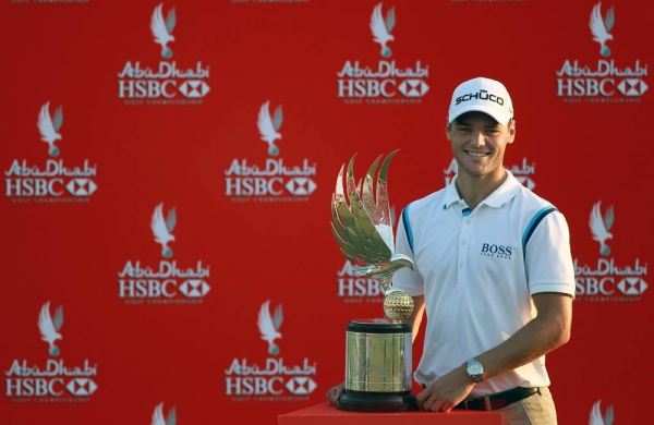 Martin Kaymer of Germany poses with the trophy after winning The Abu Dhabi HSBC Golf Championship at Abu Dhabi Golf Club on Jan. 23, 2011 in Abu Dhabi, UAE.  — courtesy Andrew Redington