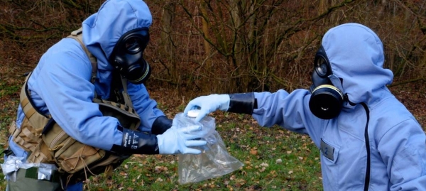Inspectors from the Organization for the Prohibition of Chemical Weapons are seen in full protective gear, collecting samples during a mock exercise in this file picture. — Courtesy photo