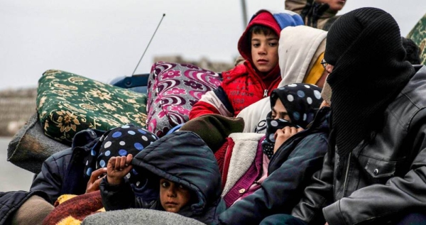 File photo shows a family fleeing the violence in Idlib, Syria. — courtesy UNOCHA/HFO