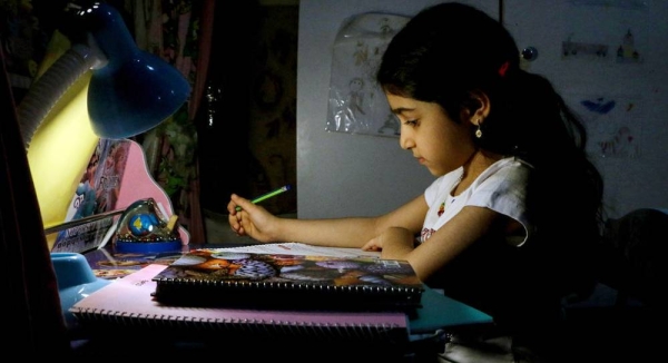 An eight-year-old child studies at home in Ahavaz, Iran, as schools are closed due to COVID-19. Many pupils in disadvantaged areas of the city do not have electronic devices and cannot access virtual lessons. — courtesy UNICEF