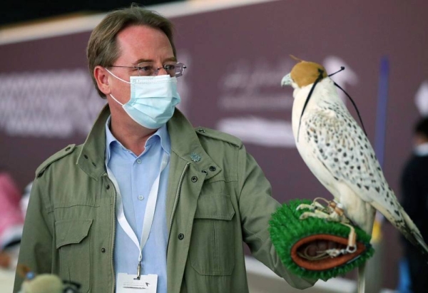 French Ambassador Ludovic Pouille seen holding a falcon during his visit to the King Abdulaziz Falconry Festival on Saturday.