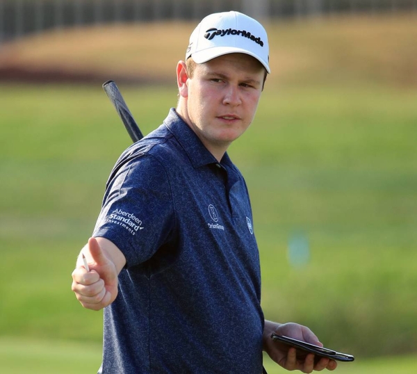 Victor Perez of France tees off on the 1st hole during Day One of the DP World Tour Championship at Jumeirah Golf Estates on Dec. 10, 2020 in Dubai, United Arab Emirates. (Photo by Andrew Redington)