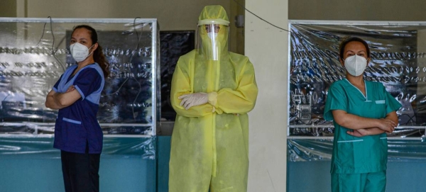 Wearing a full protective suit, a women doctor who leads a group of volunteer medical professionals attending to COVID-19 patients and persons under investigation at a community hospital in the Philippines. — Coutesy photo