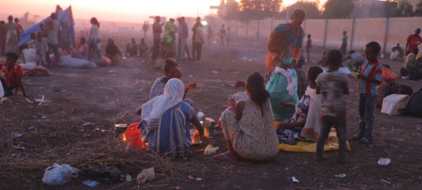 Ethiopian refugees fleeing clashes in the country's northern Tigray region, rest and cook meals near UNHCR's Hamdayet reception centre after crossing into Sudan. — Courtesy photo