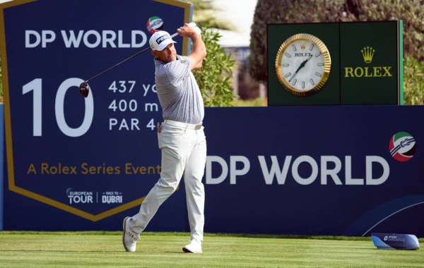 Matthew Fitzpatrick with DP World Tour Championship trophy.