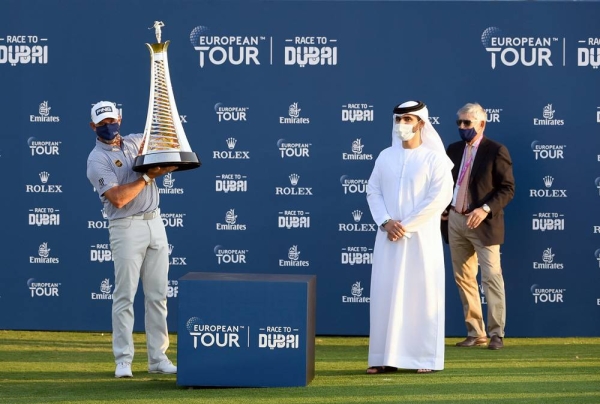 Matthew Fitzpatrick with DP World Tour Championship trophy.