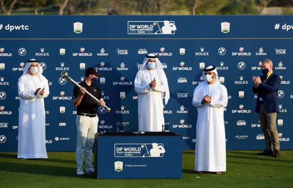 Matthew Fitzpatrick with DP World Tour Championship trophy.