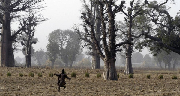 A child runs in a field in a village in Katsina state, northwest Nigeria. — courtesy UNICEF/Christine Nesbitt