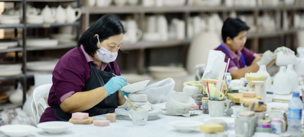 Women migrant workers at a ceramics factory in northern Thailand. As part of the labor force, migrant workers support local businesses and also communities back home. — Courtesy file photo