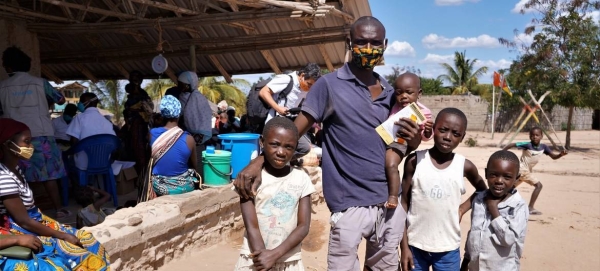 A father in Cabo Delgado, Mozambique, receives supplementary food packs for his children. — Courtesy file photo